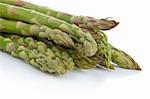 A bunch of asparagus reflected on white background