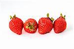 Big red strawberry against white background