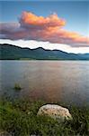 Colorful sunset over the peaceful lake on spring