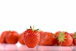 strawberry with stack of strawberries on background, with shallow dof