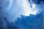 dramatic deep blue cloudscape, brightly lit in several places