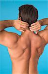 close up of a young man back over blue background