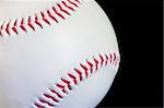 A baseball on a black background