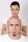 a woman covering man`s ears with her hands