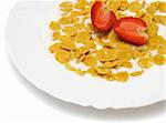 cornflakes with milk and strawberry in white plate on white background