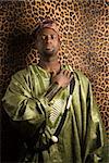 Portrait of African- American mid-adult man wearing traditional African clothing.