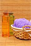 Bath accessories and beauty products on bamboo mat