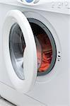 White washing machine with open door.