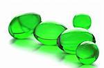 An abstract picture of vitamins pills in green color