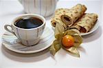 Two cups on a green wooden napkin