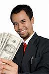 Smiling businessman holding money over a white background