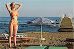 careless woman tanning on the seaside beach