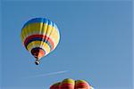 balloon in flight with jet beyond