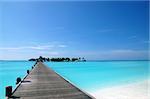 footbridge over turquoise ocean on an maldivian island