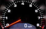 Sportscar dashboard closeup with backlit speedometer