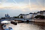 View of Seine and Notre Dame cathedral in Paris, France in the evening