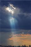 Cumulus clouds with sun rays - God looks down at earth.