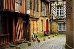 Medieval street with half-timebered houses in Rennes, France.