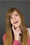 Teenage girl posing on gray background with some attitude