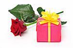 Red rose and a pink gift box