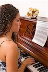 Teenage girl playing piano