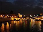 seine river at night with boat moving
