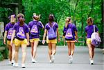 Group of Cheerleaders Walking on a Path