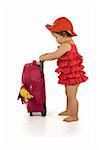 Little girl in purple dress and hat, holding a purple luggage (isolated, with a bit of shadow, clipping path)