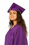 Young female in graduation gown smiling