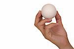 Feminine hand holding miniaturized rubber golf ball over white background