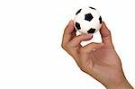 Feminine hand holding miniaturized rubber soccer ball over white background