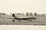 Aged photo of classic WWII propeller airplane