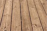 old, weathered wooden floor with perspective, taken outdoors