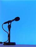 Microphone over blue background