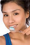 Latina teenager girl brushes her teeth