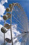 a giant whell attraction in a park in Paris