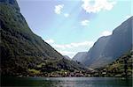 Fjord Scenic from the pass between Aurlandsfjord and naeroyfjord (nærøyfjord), in Sognefjord, Norway.  Blue sky and sun with lens flare.