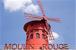 The famous Moulin Rouge over a blue sky