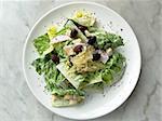 top shot of caesar salad on marble table