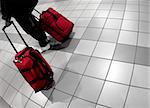 Man with red bags at the airport