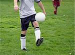 Man with a ball on a soccer field