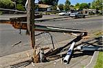 Power pole severed in half during a car accident on a residential street