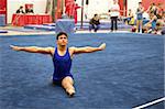 Young gymnast competing on floor