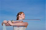 Attractive female model holding a samurai sword