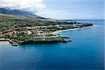 Aerial view of buildings on coastline of Maui, Hawaii.