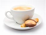 Cup of cofee on a saucer with some cookies