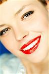 Portrait of beautiful young woman with red lipstick