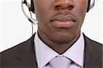 This is an image of close up of a man with a microphone headset on. This image can be used for telecommunication and service themes.