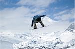 snowboarder jumping high in the air