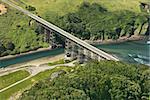 Aerial of Shoreline Highway bridge over water in California, USA.